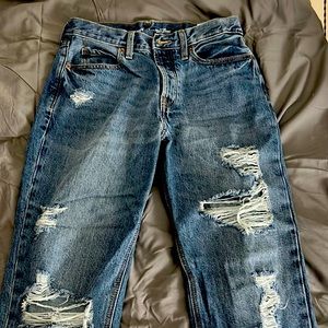 Ripped ankle length jeans.